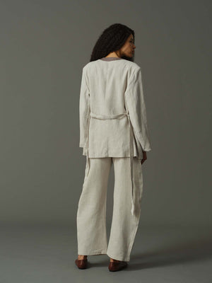 back of a model wearing light grey suit 