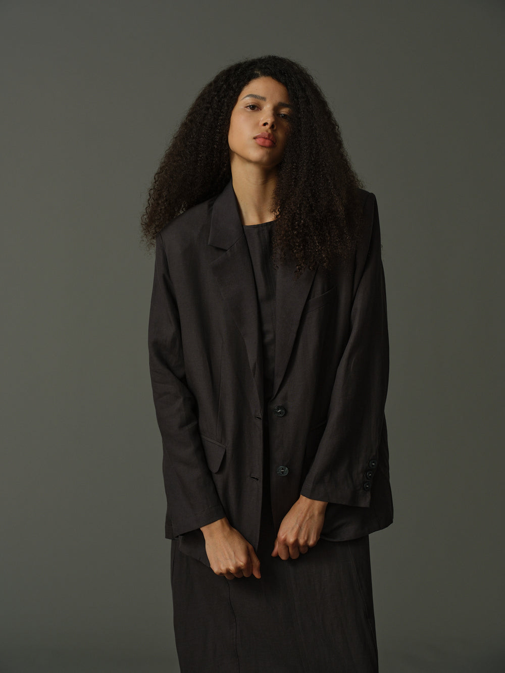 Black blazer on a beige background