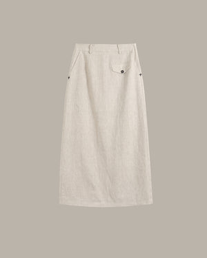 A light beige linen midi skirt with a single buttoned flap pocket on the right side, shown flat against a solid taupe background.