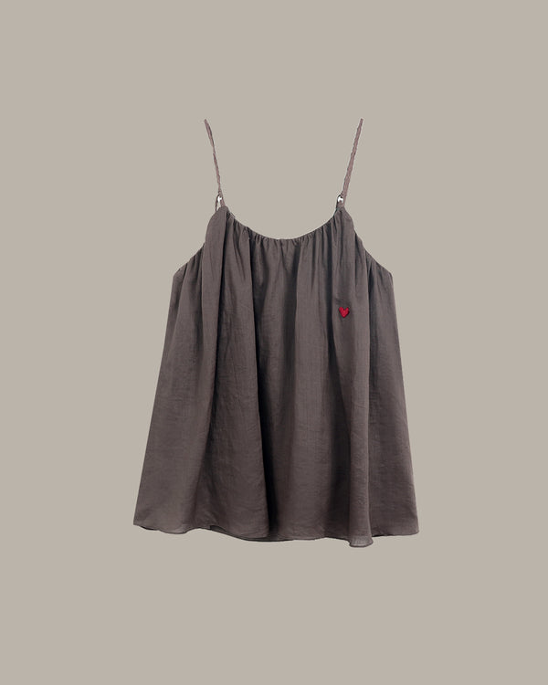 Brown cami with thin straps on a beige background