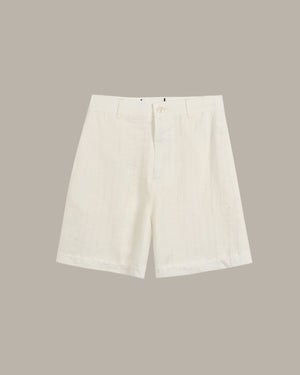White shorts on a beige background