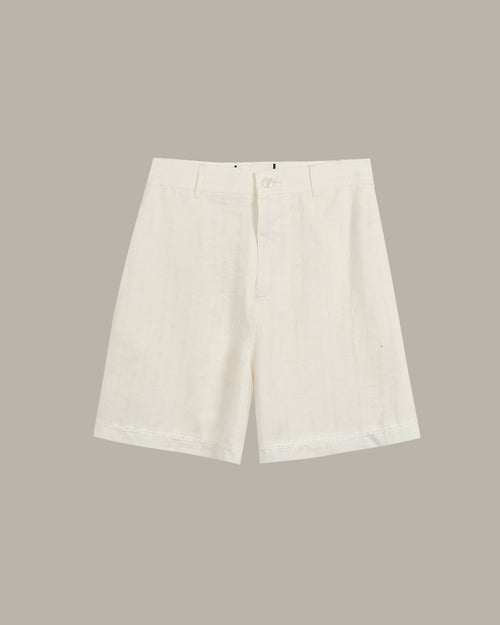 White shorts on a beige background