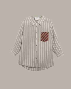 Striped shirt with a red pocket on a beige background