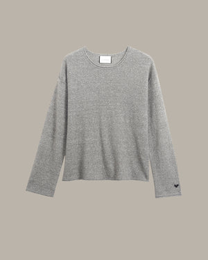 A light gray heathered knit long-sleeve top with a crew neck, displayed flat against a solid taupe background.