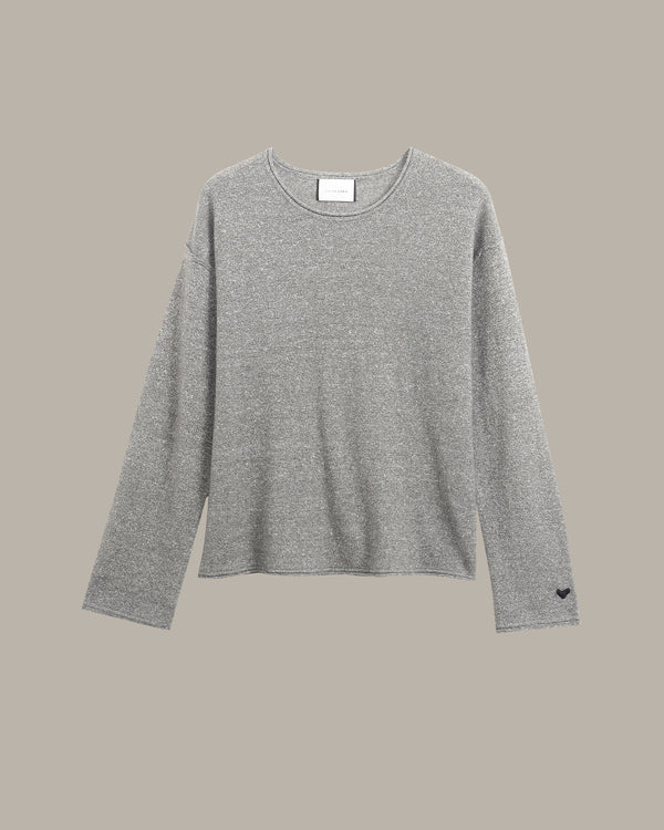 A light gray heathered knit long-sleeve top with a crew neck, displayed flat against a solid taupe background.