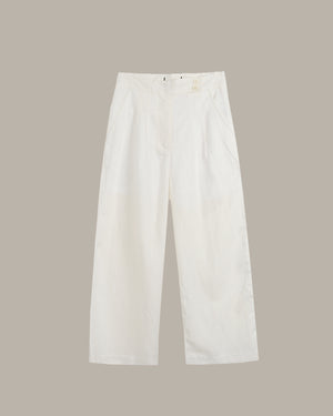 White pants on a beige background