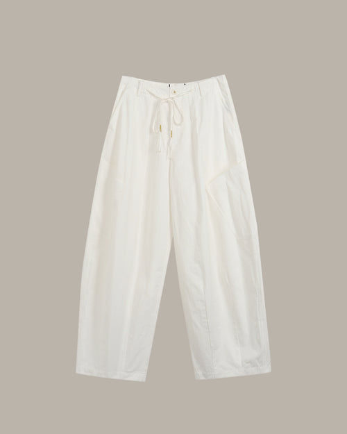 White pants on a beige background