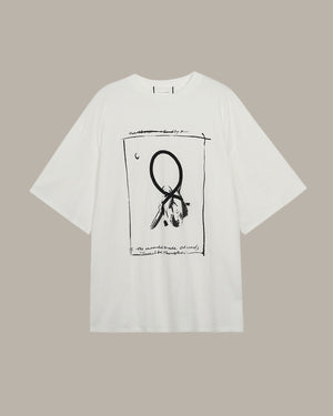 White t-shirt with black graphic design on a beige background