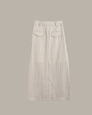 Light gray pants with two front pockets on a beige background