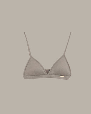 Gray triangle bikini top on a beige background