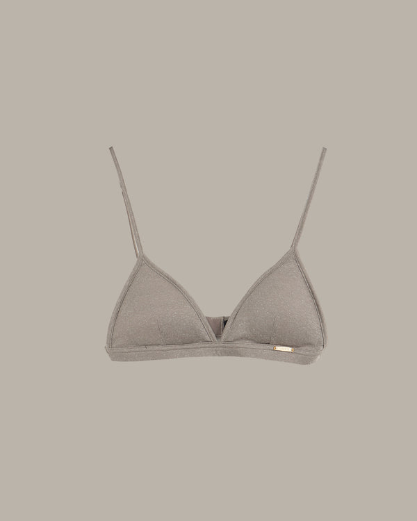 Gray triangle bikini top on a beige background
