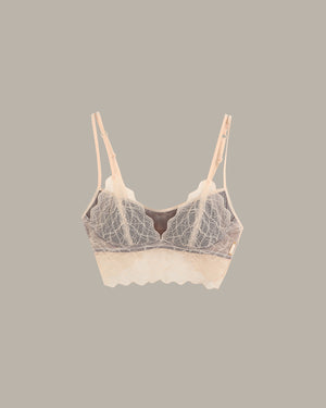 Lace-trimmed bra on a gray background