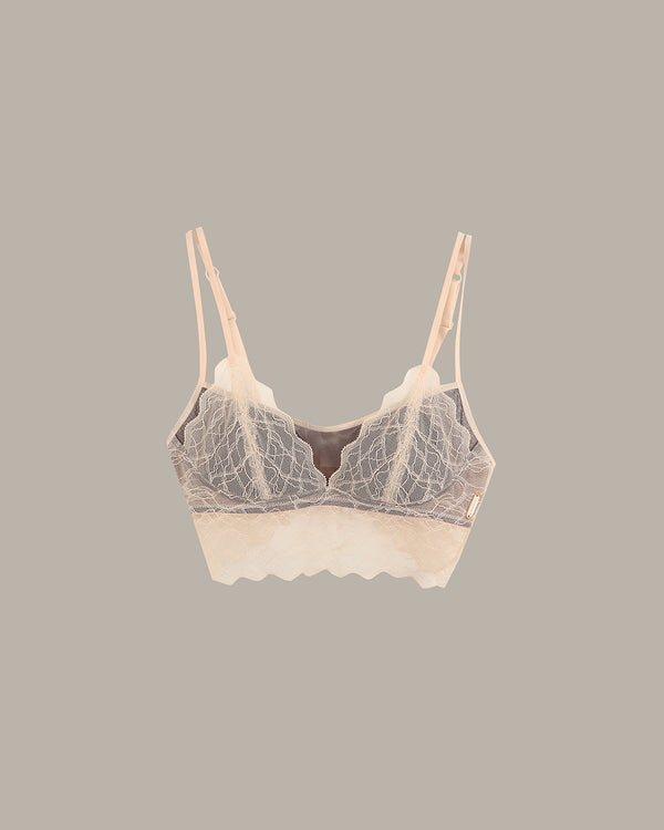 Lace-trimmed bra on a gray background