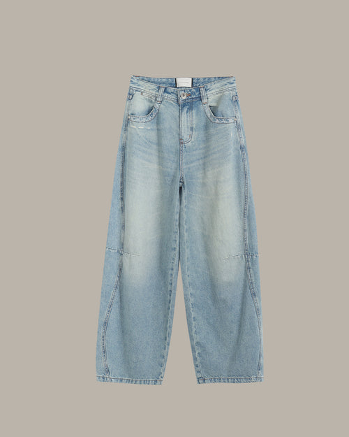 Light blue jeans on a beige background