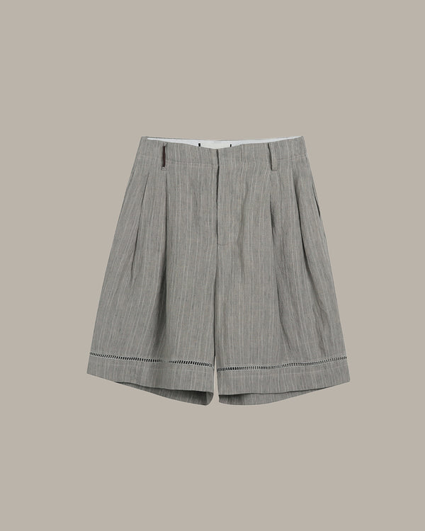 Gray pleated skirt on a beige background