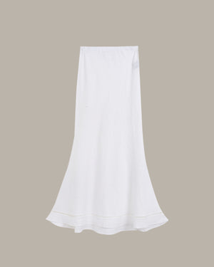 White skirt on a beige background
