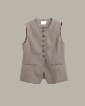 A sleeveless taupe-brown vest with a button-down front and two front pockets, displayed flat against a solid taupe background.