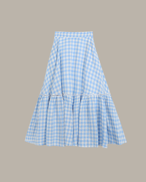 Blue and white checkered skirt on a gray background