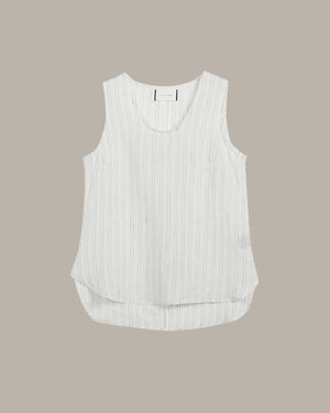White sleeveless top with thin black stripes on a beige background