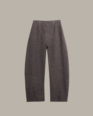 Dark gray pants on a beige background