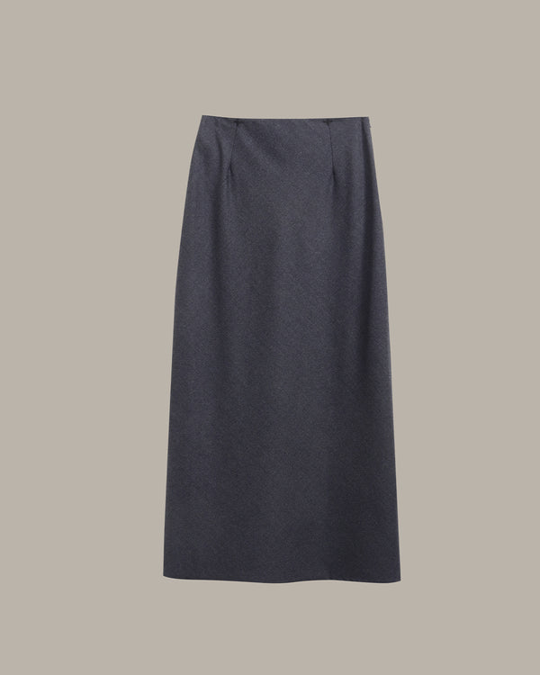 A dark charcoal gray pleated skirt displayed flat against a solid taupe-gray background.