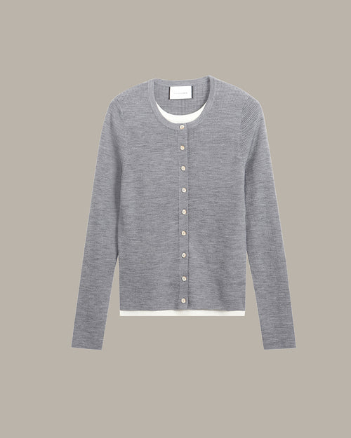 A light gray long-sleeve cardigan sweater with a button-up front, displayed flat against a solid taupe background.