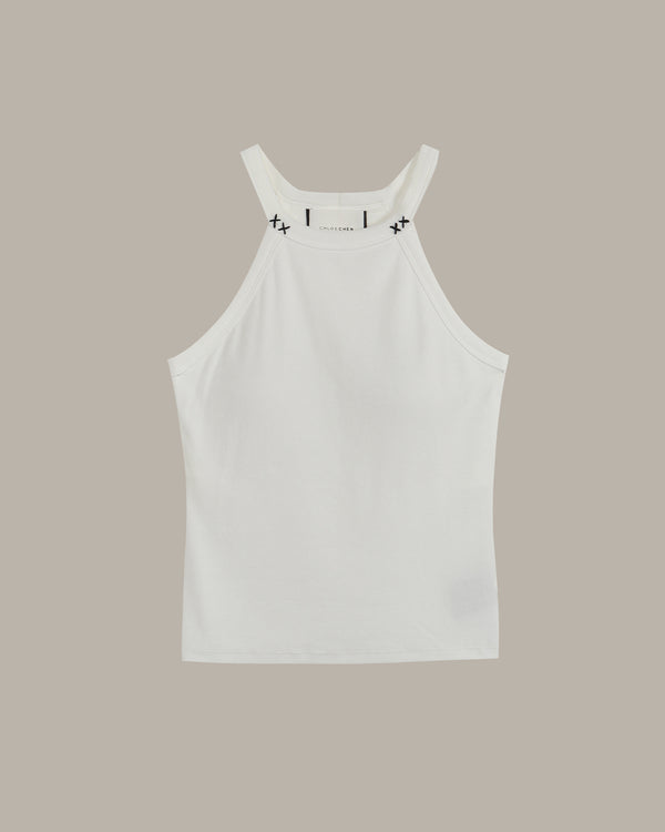 White halter neck tank top with black stitch on a beige background