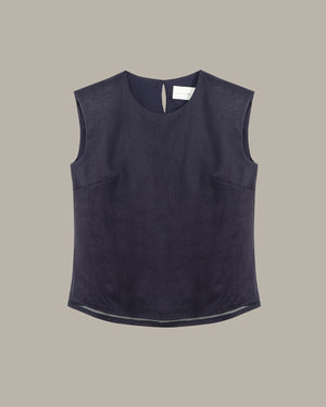 Dark blue sleeveless top on a beige background