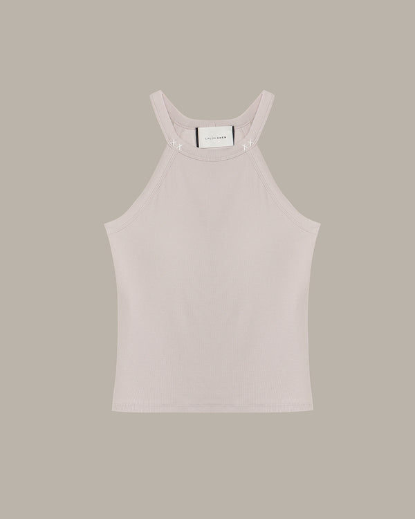 Light pink tank top on a beige background