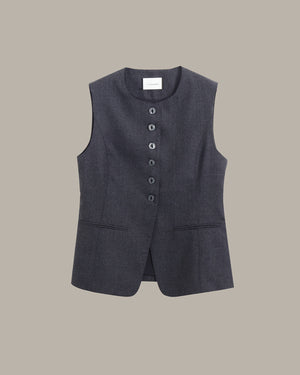 A dark gray sleeveless vest with a button-down front and two front pockets, displayed flat against a solid taupe background.