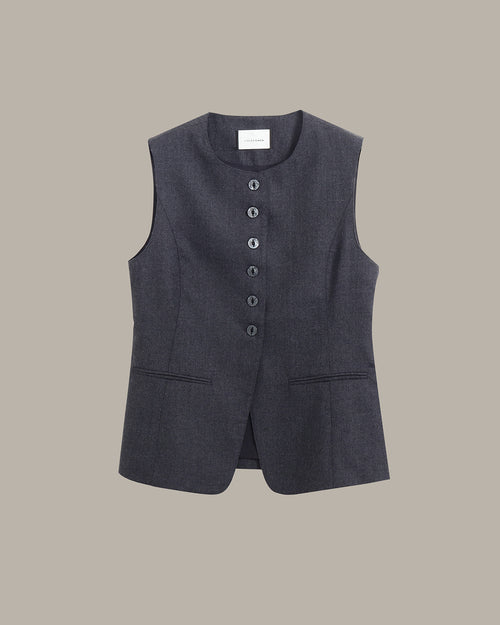 A dark gray sleeveless vest with a button-down front and two front pockets, displayed flat against a solid taupe background.