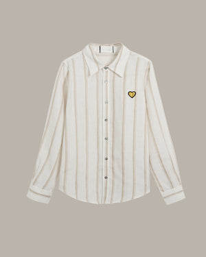 Striped shirt with a heart emblem on a beige background