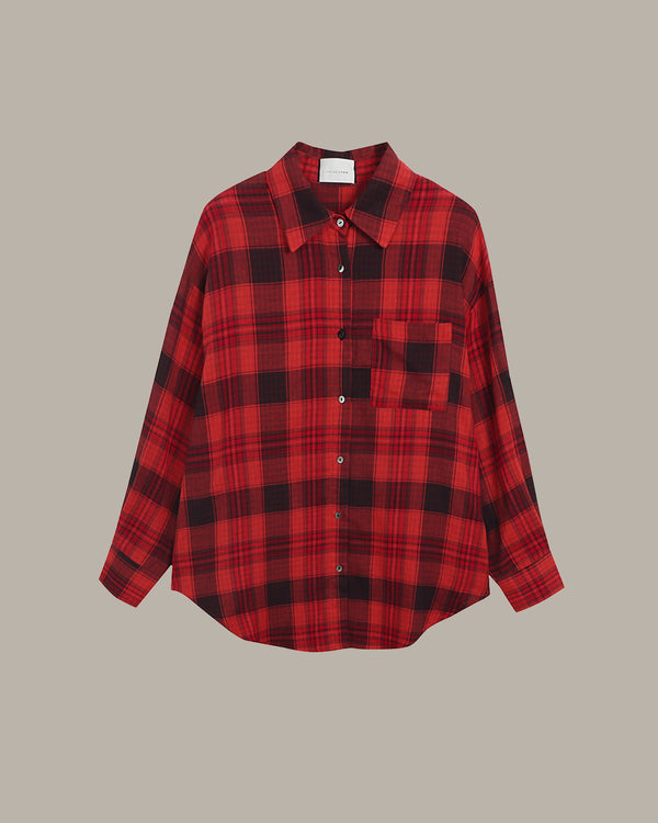 Red and black plaid shirt on a beige background