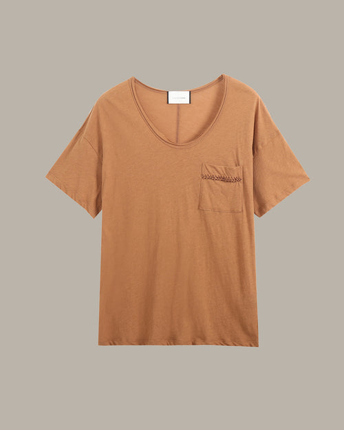 Brown t-shirt with a pocket on a gray background