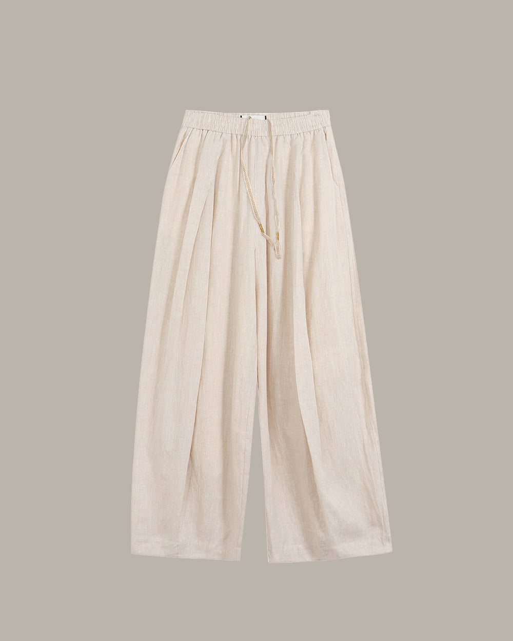 Beige wide-leg pants on a light gray background