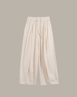 Beige wide-leg pants on a light gray background