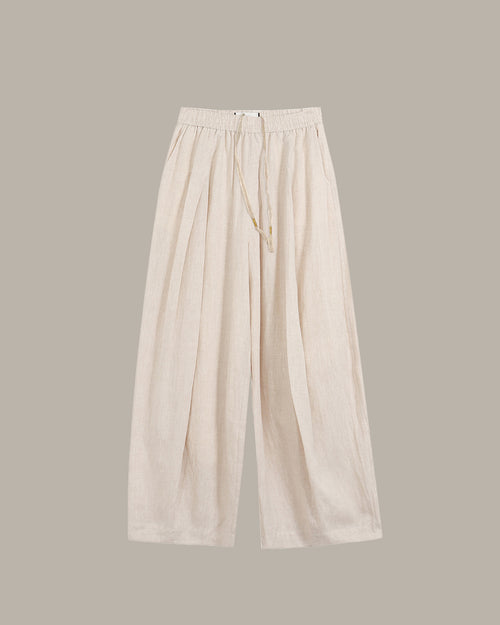 Beige wide-leg pants on a light gray background