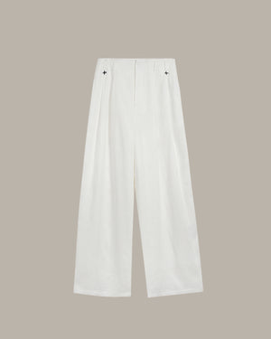 White pants on a beige background