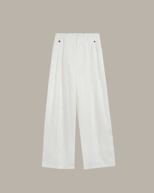 White pants on a beige background