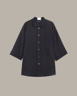 Black shirt on a beige background