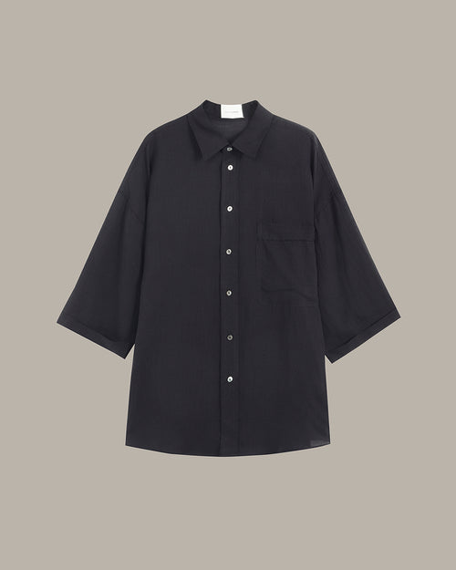 Black shirt on a beige background