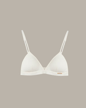 white triangle bralette on a beige background