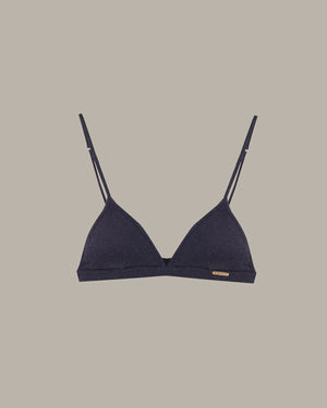 Navy blue bralette with thin straps on a beige background