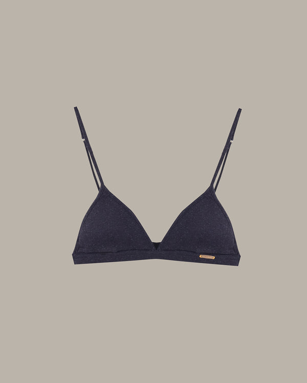 Navy blue bralette with thin straps on a beige background