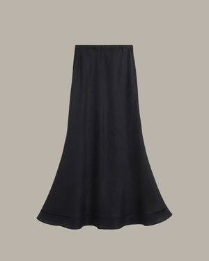 Black skirt on a beige background