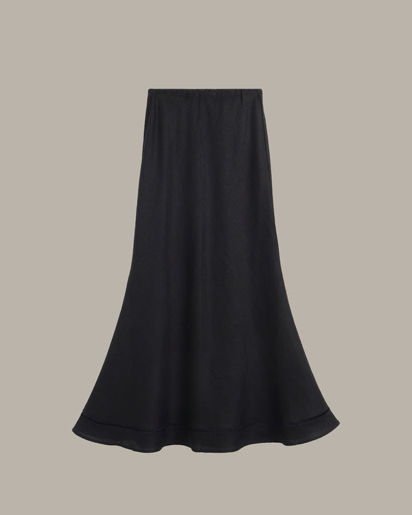Black skirt on a beige background