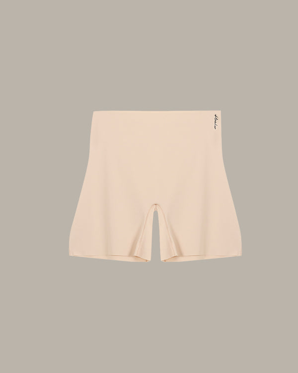 Beige bike shorts on a light gray background