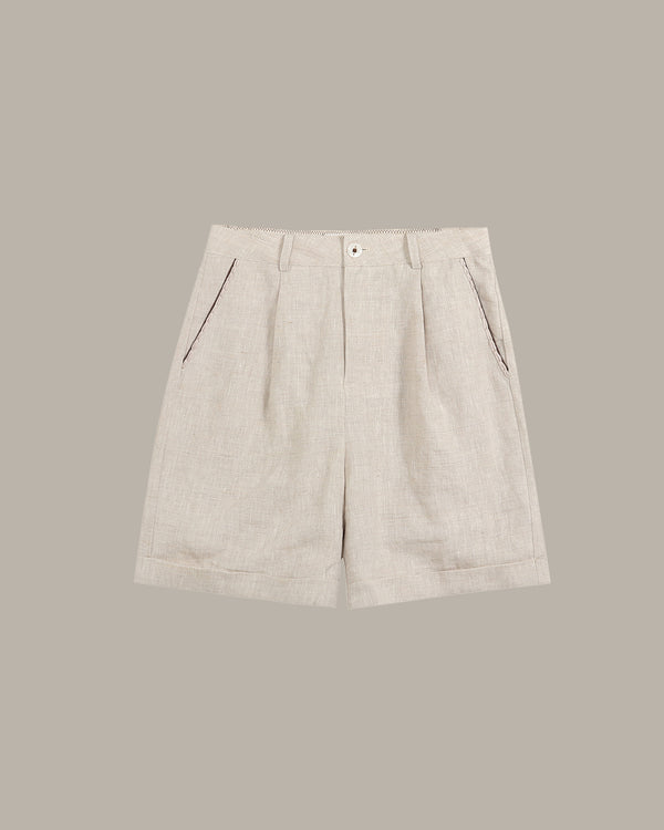 Beige shorts on a light gray background