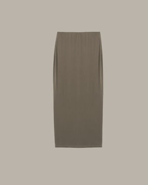 Green skirt on a beige background