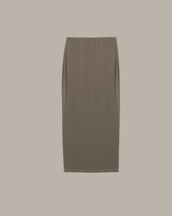 Green skirt on a beige background